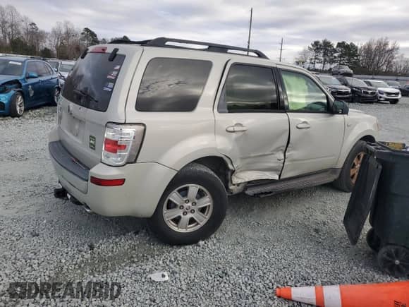 2009 Mercury Mariner with VIN 4M2CU81759KJ04555, listed as a Copart auction lot 85778504 with 130,514 mi miles and Salvage title. Bid and sale history available at DreamBid. Image 3.