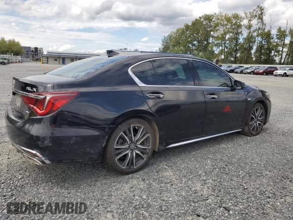 ✅ 2018 Acura RLX Hybrid Sport • VIN: JH4KC2F91JC000122 • Лот: 69392385. Опубликован ранее на Copart с пробегом 74 797 миль. Бесплатный доступ к архиву аукционных продаж из США и подробный отчёт об истории автомобиля на DreamBid. Изображение 3.