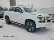 2020 Chevrolet Tahoe Premier with VIN 1GNSKCKJXLR182971, listed as a Copart auction lot 87268634 with 210,000 mi miles and Salvage title. Bid and sale history available at DreamBid. Image 4.