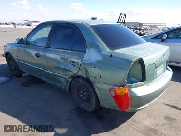 2005 Hyundai Accent GLS z VIN KMHCG45C95U620716, wystawiony jako IAAI lot #41740573 z przebiegiem 187 971 mil mil oraz . Historia ofert i sprzedaży dostępna na DreamBid. Obrazek 6.