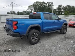 ✅ 2023 Chevrolet Colorado 4WD ZR2 • VIN: 1GCPTFEK1P1235806 • Лот: 72759114. Опубликован ранее на Copart с пробегом 11 090 миль. Бесплатный доступ к архиву аукционных продаж из США и подробный отчёт об истории автомобиля на DreamBid. Изображение 3.
