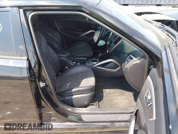 2016 Hyundai Veloster with VIN KMHTC6AD3GU300624, listed as a IAAI auction lot 42951960 with 83,779 mi miles and . Bid and sale history available at DreamBid. Image 5.