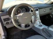 ✅ 2004 Chrysler Crossfire • VIN: 1C3AN69L94X002966 • Lot: 76795154. Listed on Copart with 14,235 mi. Free auction sales archive from the USA and detailed vehicle history report at DreamBid. Image 8.