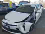 2021 Toyota Prius L Eco with VIN JTDKAMFU4M3134943, listed as a IAAI auction lot 43175713 with 106,611 mi miles and . Bid and sale history available at DreamBid. Image 2.