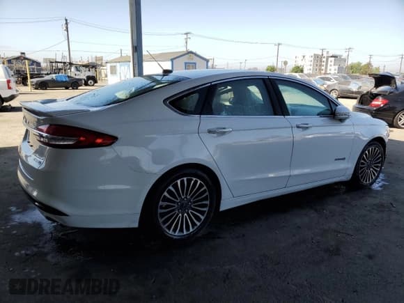 ✅ 2017 Ford Fusion Hybrid Titanium • VIN: 3FA6P0RUXHR234093 • Lot: 57997865. Wystawiony na Copart z przebiegiem 124 862 mil. Bezpłatny archiwum sprzedaży aukcyjnych z USA i szczegółowy raport historii pojazdu na DreamBid. Zdjęcie 3.