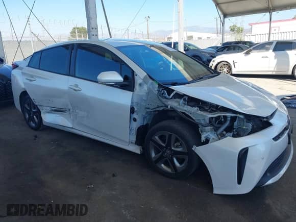 2021 Toyota Prius L Eco with VIN JTDKAMFU4M3134943, listed as a IAAI auction lot 43175713 with 106,611 mi miles and . Bid and sale history available at DreamBid. Image 14.