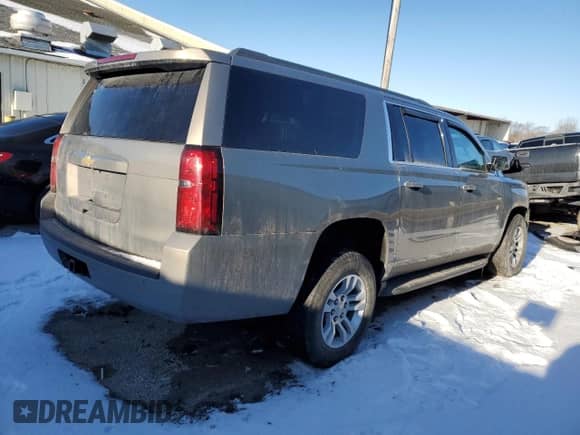 2018 Chevrolet Suburban LS z VIN 1GNSKGKC1JR201493, wystawiony jako Copart lot #87856345 z przebiegiem Nie podano mil oraz Szkoda całkowita • Salvage title. Historia ofert i sprzedaży dostępna na DreamBid. Obrazek 3.