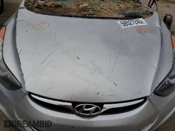 2013 Hyundai Elantra Limited с VIN KMHDH4AE0DU008248, выставлен на аукционе Copart как лот 58527245 с пробегом Не указан миль и Списание • Salvage title. История ставок и продаж доступна на DreamBid. Изображение 11.