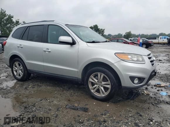 ✅ 2012 Hyundai Santa Fe SE • VIN: 5XYZHDAG2CG120688 • Lot: 81621865. Listed on Copart with 96,276 mi. Free auction sales archive from the USA and detailed vehicle history report at DreamBid. Image 4.