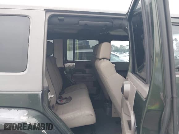 ✅ 2007 Jeep Wrangler Unlimited Sahara • VIN: 1J4GA59147L218594 • Lot: 42984397. Listed on IAAI with 108,296 mi. Free auction sales archive from the USA and detailed vehicle history report at DreamBid. Image 8.