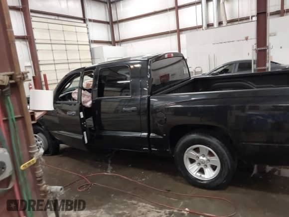 2009 Dodge Dakota z VIN 1D3HW38P49S789556, wystawiony jako IAAI lot #42475126 z przebiegiem Nie podano mil oraz . Historia ofert i sprzedaży dostępna na DreamBid. Obrazek 15.