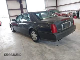 ✅ 2001 Cadillac DeVille • VIN: 1G6KD54Y51U279968 • Lot: 42202847. Listed on IAAI with 173,066 mi. Free auction sales archive from the USA and detailed vehicle history report at DreamBid. Image 3.