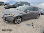 ✅ 2014 Ford Fusion Titanium Hybrid • VIN: 3FA6P0RU5ER398119 • Lot: 92226625. Wystawiony na Copart z przebiegiem 208 179 mil. Bezpłatny archiwum sprzedaży aukcyjnych z USA i szczegółowy raport historii pojazdu na DreamBid. Zdjęcie 1.