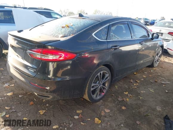 ✅ 2020 Ford Fusion Titanium • VIN: 3FA6P0K91LR198146 • Lot: 43388190. Wystawiony na IAAI z przebiegiem 53 857 mil. Bezpłatny archiwum sprzedaży aukcyjnych z USA i szczegółowy raport historii pojazdu na DreamBid. Zdjęcie 4.