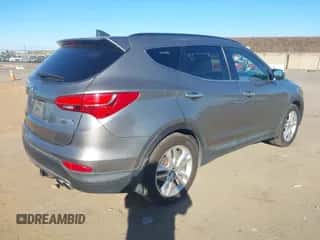 2015 Hyundai Santa Fe z VIN 5XYZWDLA9FG240216, wystawiony jako IAAI lot #43616955 z przebiegiem 203 691 mil mil oraz . Historia ofert i sprzedaży dostępna na DreamBid. Obrazek 4.