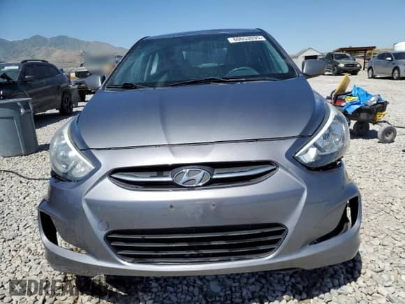 2005 Hyundai Accent GLS z VIN KMHCT4AEXFU929213, wystawiony jako Copart lot #60053935 z przebiegiem 152 892 mil mil oraz Szkoda całkowita • Salvage title. Historia ofert i sprzedaży dostępna na DreamBid. Obrazek 5.