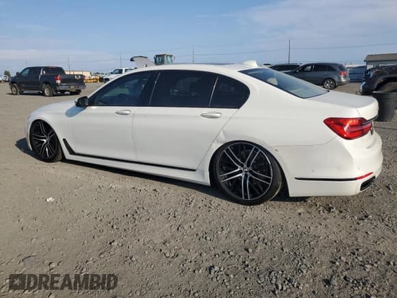 ✅ 2016 BMW 7 Series 740i • VIN: WBA7E2C52GG547305 • Лот: 80148255. Опубликован ранее на Copart с пробегом 99 952 миль. Бесплатный доступ к архиву аукционных продаж из США и подробный отчёт об истории автомобиля на DreamBid. Изображение 2.