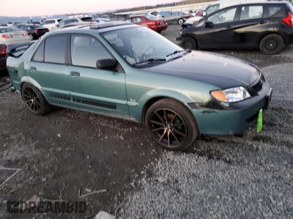 ✅ 2001 Mazda Protege LX • VIN: JM1BJ226510415089 • Lot: 44941835. Wystawiony na Copart z przebiegiem Nie podano. Bezpłatny archiwum sprzedaży aukcyjnych z USA i szczegółowy raport historii pojazdu na DreamBid. Zdjęcie 4.