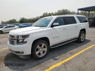 2017 Chevrolet Suburban Premier z VIN 1GNSCJKC1HR399772, wystawiony jako Copart lot #66577745 z przebiegiem 144 780 mil mil oraz Szkoda całkowita • Salvage title. Historia ofert i sprzedaży dostępna na DreamBid. Obrazek 1.