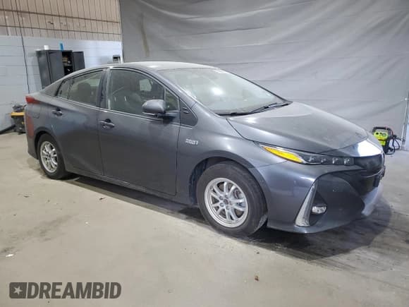 ✅ 2021 Toyota Prius LE • VIN: JTDKAMFPXM3176253 • Lot: 82098695. Listed on Copart with 64,523 mi. Free auction sales archive from the USA and detailed vehicle history report at DreamBid. Image 4.