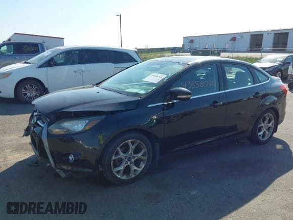 ✅ 2014 Ford Focus Titanium • VIN: 1FADP3J23EL237429 • Lot: 43358765. Listed on IAAI with 138,960 mi. Free auction sales archive from the USA and detailed vehicle history report at DreamBid. Image 17.