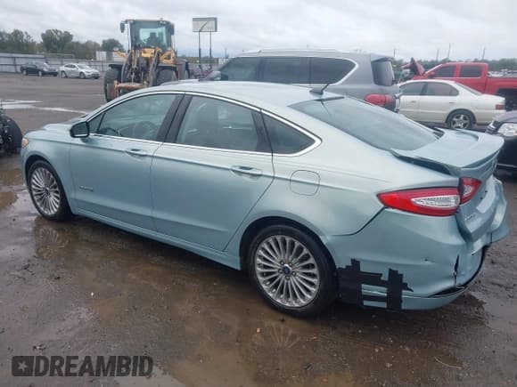 ✅ 2014 Ford Fusion Titanium Hybrid • VIN: 3FA6P0RU8ER350016 • Lot: 43532622. Listed on IAAI with 87,458 mi. Free auction sales archive from the USA and detailed vehicle history report at DreamBid. Image 3.
