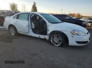 ✅ 2014 Chevrolet Impala LTZ • VIN: 2G1WC5E39E1152302 • Lot: 86253965. Listed on Copart with 121,662 mi. Free auction sales archive from the USA and detailed vehicle history report at DreamBid. Image 4.