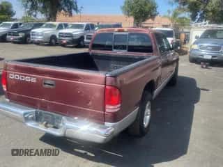 2000 Dodge Dakota z VIN 1B7GL22X1YS549590, wystawiony jako Copart lot #72645444 z przebiegiem 179 924 mil mil oraz Czysty tytuł • Clean title. Historia ofert i sprzedaży dostępna na DreamBid. Obrazek 4.