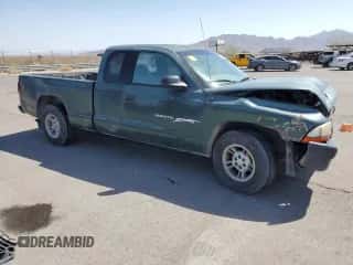 2000 Dodge Dakota with VIN 1B7GL22X8YS720710, listed as a Copart auction lot 71579604 with 302,044 mi miles and Salvage title. Bid and sale history available at DreamBid. Image 4.