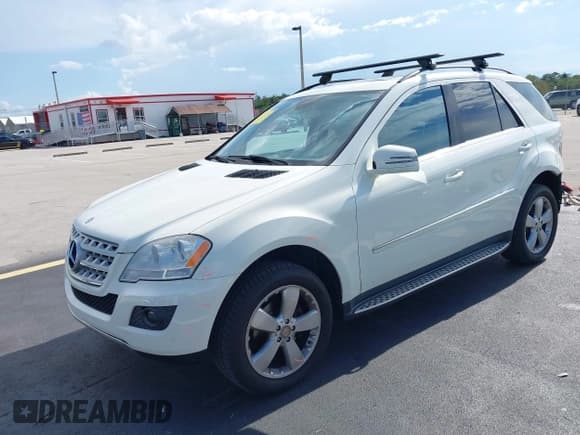 ✅ 2011 Mercedes-Benz M 350 • VIN: 4JGBB5GB1BA648155 • Lot: 42991750. Listed on IAAI with 165,036 mi. Free auction sales archive from the USA and detailed vehicle history report at DreamBid. Image 2.