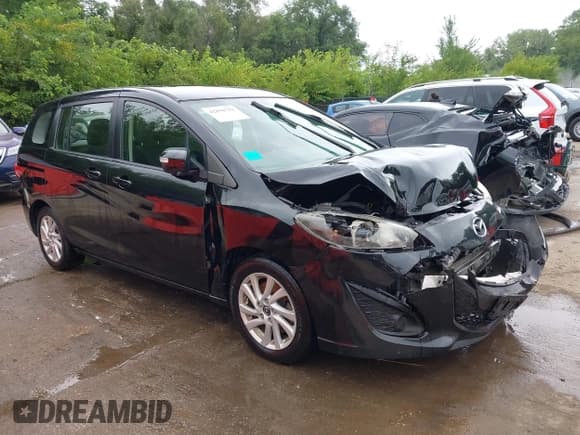 ✅ 2013 Mazda 5 Sport • VIN: JM1CW2BL8D0145212 • Lot: 42876752. Listed on IAAI with 126,517 mi. Free auction sales archive from the USA and detailed vehicle history report at DreamBid. Image 1.