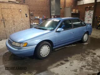 ✅ 1994 Ford Taurus GL • VIN: 1FALP52U7RA157642 • Lot: 81813425. Listed on Copart with 245,972 mi. Free auction sales archive from the USA and detailed vehicle history report at DreamBid. Image 1.