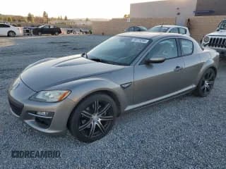 ✅ 2009 Mazda RX-8 Grand Touring • VIN: JM1FE17M990403160 • Lot: 86778244. Listed on Copart with 115,207 mi. Free auction sales archive from the USA and detailed vehicle history report at DreamBid. Image 1.