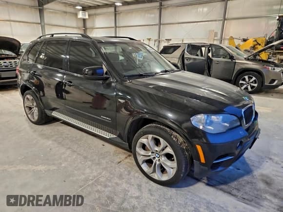 ✅ 2012 BMW X5 50i • VIN: 5UXZV8C51CL424965 • Лот: 93650355. Опубликован ранее на Copart с пробегом 121 895 миль. Бесплатный доступ к архиву аукционных продаж из США и подробный отчёт об истории автомобиля на DreamBid. Изображение 4.