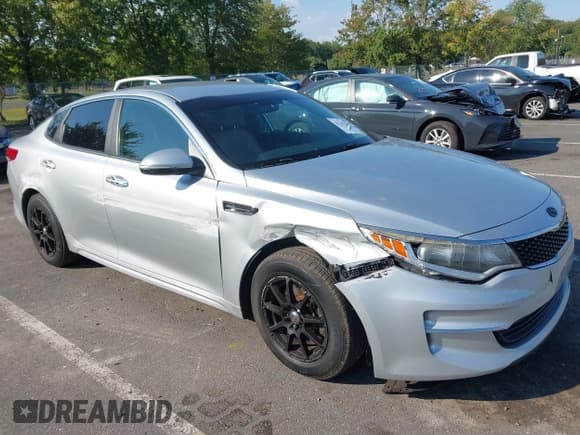 ✅ 2016 Kia Optima LX Turbo • VIN: 5XXGT4L12GG002648 • Lot: 43213712. Listed on IAAI with 165,896 mi. Free auction sales archive from the USA and detailed vehicle history report at DreamBid. Image 1.