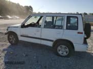 ✅ 1997 Geo Tracker LSi • VIN: 2CNBE1360V6927915 • Lot: 53469605. Listed on Copart with 119,413 mi. Free auction sales archive from the USA and detailed vehicle history report at DreamBid. Image 2.