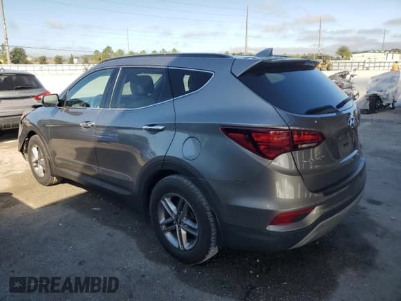 ✅ 2018 Hyundai Santa Fe 2.4L • VIN: 5XYZU3LB3JG556034 • Lot: 90231035. Listed on Copart with 26,542 mi. Free auction sales archive from the USA and detailed vehicle history report at DreamBid. Image 2.