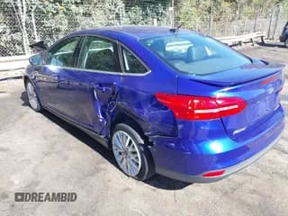 ✅ 2015 Ford Focus Titanium • VIN: 1FADP3J24FL228210 • Lot: 43499726. Listed on IAAI with 121,672 mi. Free auction sales archive from the USA and detailed vehicle history report at DreamBid. Image 3.