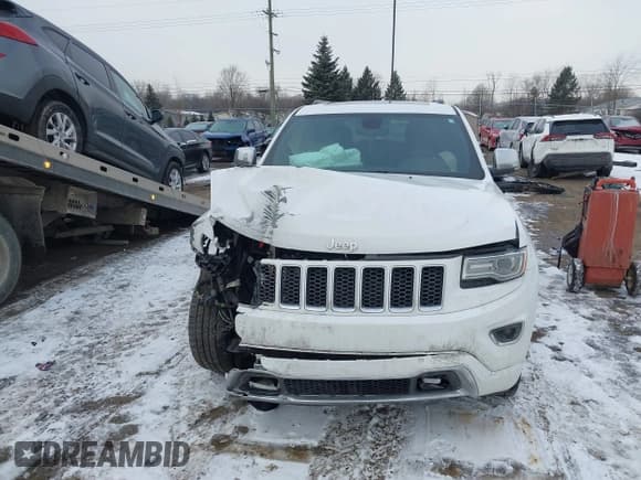 ✅ 2015 Jeep Grand Cherokee Overland • VIN: 1C4RJFCG7FC754178 • Lot: 41554947. Listed on IAAI with 164,413 mi. Free auction sales archive from the USA and detailed vehicle history report at DreamBid. Image 12.