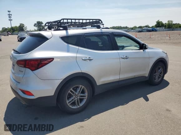 ✅ 2018 Hyundai Santa Fe 2.4L • VIN: 5XYZT3LBXJG569799 • Лот: 60612254. Опубликован ранее на Copart с пробегом 94 415 миль. Бесплатный доступ к архиву аукционных продаж из США и подробный отчёт об истории автомобиля на DreamBid. Изображение 3.