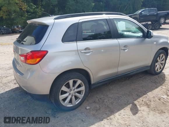 2013 Mitsubishi Outlander SE with VIN 4A4AR4AU3DE002006, listed as a IAAI auction lot 43009482 with 212,901 mi miles and . Bid and sale history available at DreamBid. Image 4.