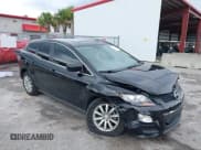 ✅ 2011 Mazda CX-7 i Touring • VIN: JM3ER2C51B0410170 • Lot: 40132736. Listed on IAAI with 105,357 mi. Free auction sales archive from the USA and detailed vehicle history report at DreamBid. Image 1.