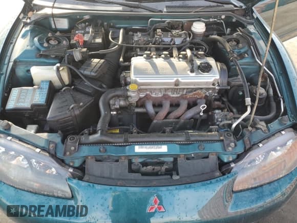 ✅ 1998 Mitsubishi Eclipse GS • VIN: 4A3AX35G8WE140054 • Лот: 84078514. Опубликован ранее на Copart с пробегом 78 756 миль. Бесплатный доступ к архиву аукционных продаж из США и подробный отчёт об истории автомобиля на DreamBid. Изображение 12.