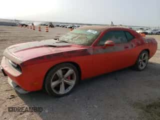 2009 Dodge Challenger SRT-8 z VIN 2B3LJ74W29H569671, wystawiony jako Copart lot #71186264 z przebiegiem Nie podano mil oraz Szkoda całkowita • Salvage title. Historia ofert i sprzedaży dostępna na DreamBid. Obrazek 1.