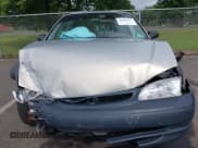 ✅ 1999 Toyota Corolla VE • VIN: 2T1BR12E9XC180124 • Lot: 42989717. Listed on IAAI with 184,062 mi. Free auction sales archive from the USA and detailed vehicle history report at DreamBid. Image 12.