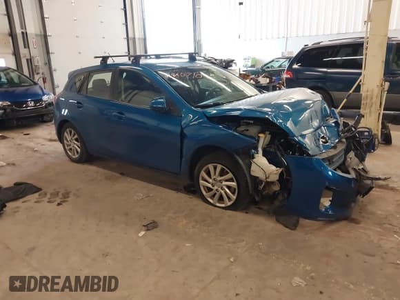 ✅ 2012 Mazda 3 i Touring • VIN: JM1BL1L81C1661610 • Lot: 41840710. Listed on IAAI with 60,567 mi. Free auction sales archive from the USA and detailed vehicle history report at DreamBid. Image 1.