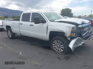 2018 Chevrolet Silverado 2500HD Work Truck with VIN 1GC1KUEG2JF222632, listed as a IAAI auction lot 43052802 with 193,796 mi miles and . Bid and sale history available at DreamBid. Image 1.