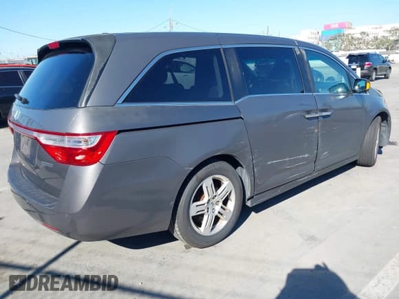 ✅ 2012 Honda Odyssey Touring • VIN: 5FNRL5H94CB106763 • Лот: 43309470. Опубликован ранее на IAAI с пробегом 154 794 миль. Бесплатный доступ к архиву аукционных продаж из США и подробный отчёт об истории автомобиля на DreamBid. Изображение 4.