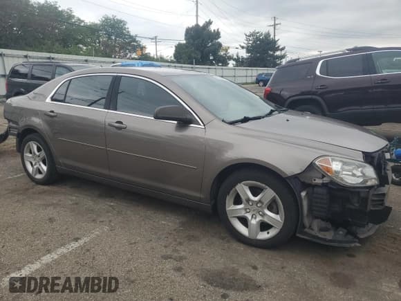 ✅ 2011 Chevrolet Malibu 1LS • VIN: 1G1ZB5E12BF232415 • Lot: 65534654. Listed on Copart with 110,594 mi. Free auction sales archive from the USA and detailed vehicle history report at DreamBid. Image 4.