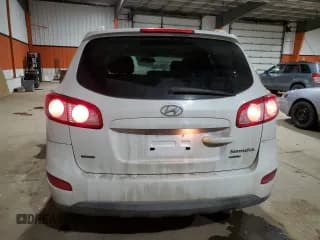 ✅ 2012 Hyundai Santa Fe GLS • VIN: 5XYZGDAG6CG113424 • Lot: 84898144. Listed on Copart with 140,697 mi. Free auction sales archive from the USA and detailed vehicle history report at DreamBid. Image 6.